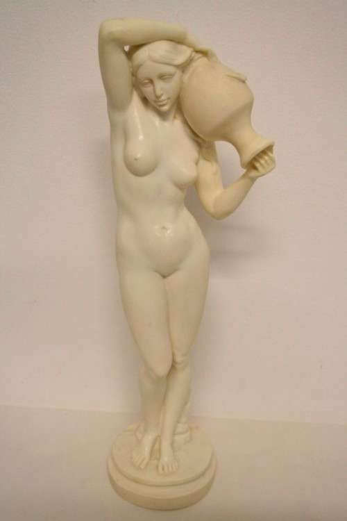 A fantastic large oxylite figurine of a woman carrying a water pitcher. Beautiful on display!!