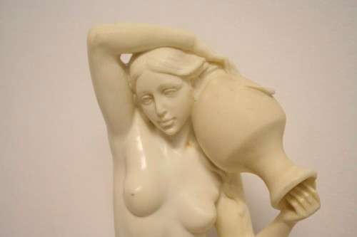 A fantastic large oxylite figurine of a woman carrying a water pitcher. Beautiful on display!!