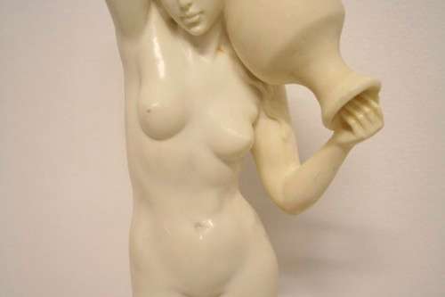 A fantastic large oxylite figurine of a woman carrying a water pitcher. Beautiful on display!!