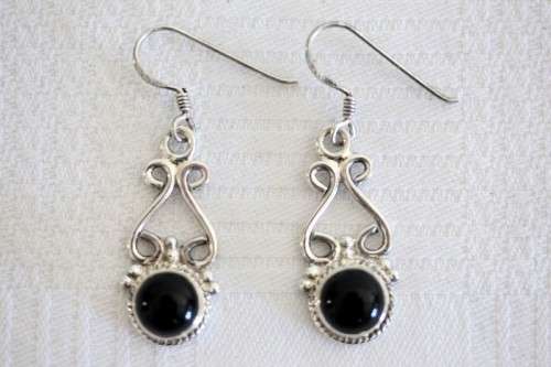A beautiful sterling silver (925) earring set with round raised onyx stones and ornate detailing