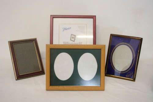 **RS17** Four lovely medium sized assorted free standing photo frames with glass.