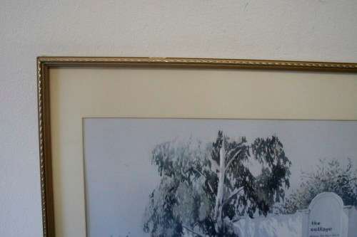 **RS17** A beautiful signed "Ted Hoefsloot" print framed behind glass of The cottage..