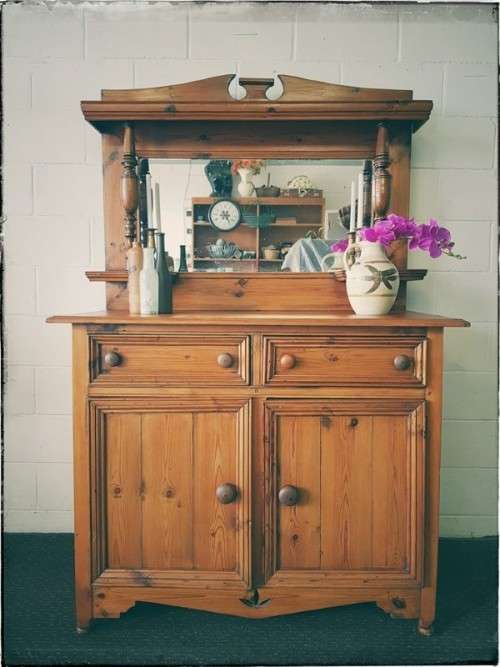 A stunning original solid Oregon 2-door server cabinet with two drawers and ample storage space