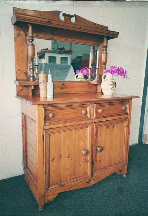 A stunning original solid Oregon 2-door server cabinet with two drawers and ample storage space