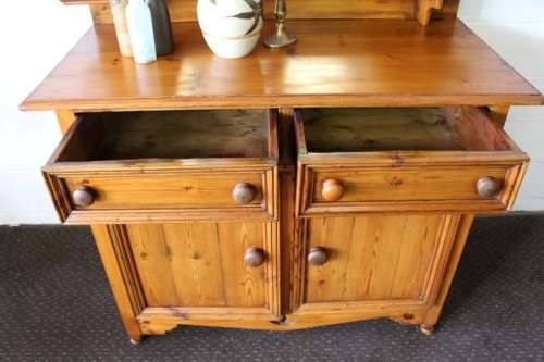 A stunning original solid Oregon 2-door server cabinet with two drawers and ample storage space