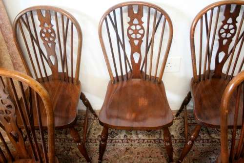 **RS17** A vintage solid Oak 6-seater dining room table with six Brace-back Windsor chairs