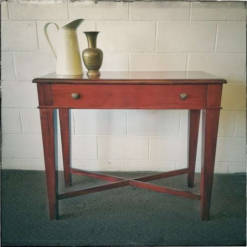 An incredible stylish "Benchmark Wood Classics" one-drawer Mahogany console table w fall-down door