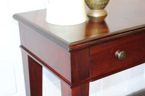 An incredible stylish "Benchmark Wood Classics" one-drawer Mahogany console table w fall-down door
