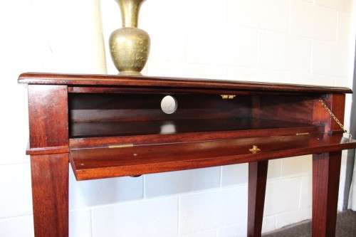 An incredible stylish "Benchmark Wood Classics" one-drawer Mahogany console table w fall-down door