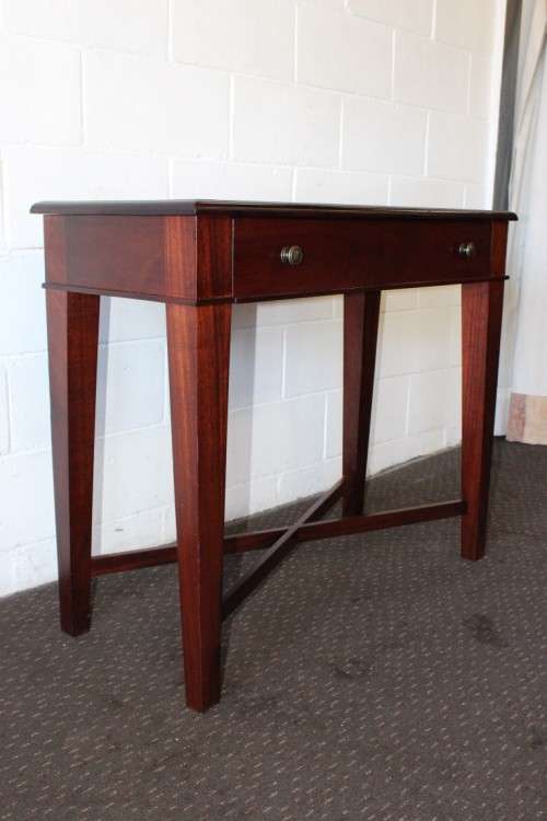 An incredible stylish "Benchmark Wood Classics" one-drawer Mahogany console table w fall-down door