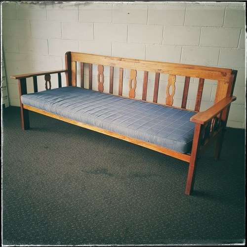 A very charming 3-seater solid Oregon daybed with an upholstered cushion - perfect for sun room!