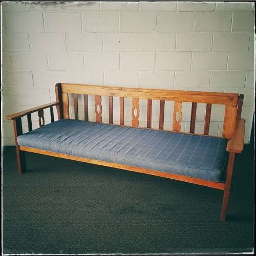 A very charming 3-seater solid Oregon daybed with an upholstered cushion - perfect for sun room!