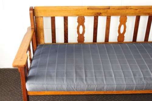 A very charming 3-seater solid Oregon daybed with an upholstered cushion - perfect for sun room!