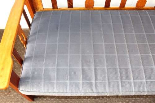 A very charming 3-seater solid Oregon daybed with an upholstered cushion - perfect for sun room!