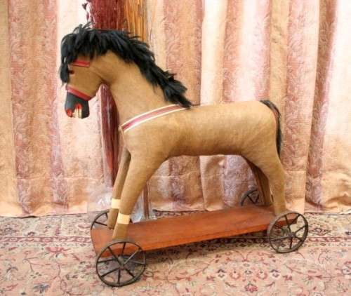 A stunning RARE antique pull toy horse on wheels in good condition - wow!!