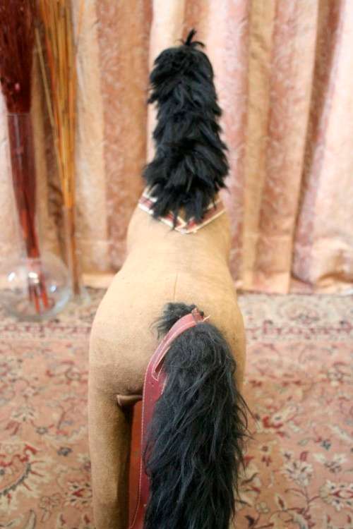 A stunning RARE antique pull toy horse on wheels in good condition - wow!!