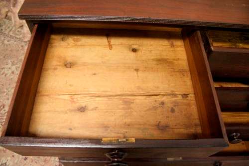 **RS17** A stylish vintage Teak 5-drawer (two over three) chest of drawers with round wood handles