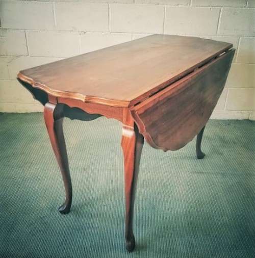 A stunning vintage solid imbuia drop-leaf dining table with beautiful slender Queen Anne legs