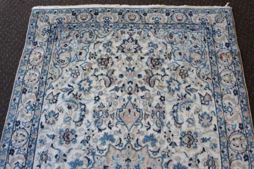 A stunning blue and white Tabriz Persian carpet in light & dark blue, white, cream & touches of red