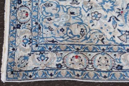 A stunning blue and white Tabriz Persian carpet in light & dark blue, white, cream & touches of red