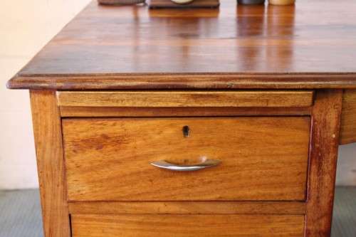 A beautiful vintage 6-drawer solid teak knee-hole partners desk with pull-out writing tops
