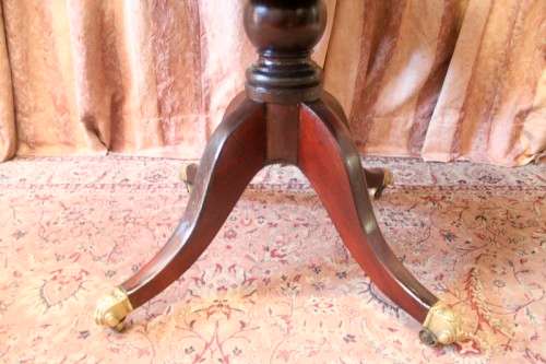 A fabulous stylish vintage drop leaf occasional table with ornate brass capped feet on castors
