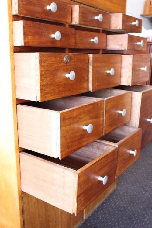 An awesome mid-century 14-drawer Apothecary cabinet with a double door cupboard and preparation top