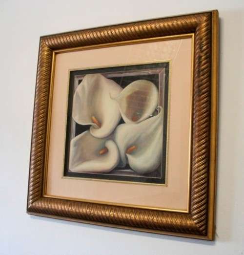 An exquisite signed "JM" print framed behind glass of four Arum Lilies. Stunning in all areas.