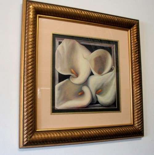 An exquisite signed "JM" print framed behind glass of four Arum Lilies. Stunning in all areas.