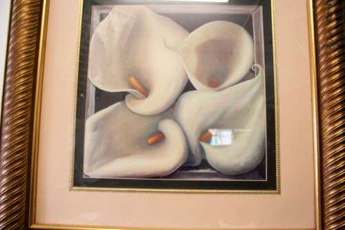 An exquisite signed "JM" print framed behind glass of four Arum Lilies. Stunning in all areas.