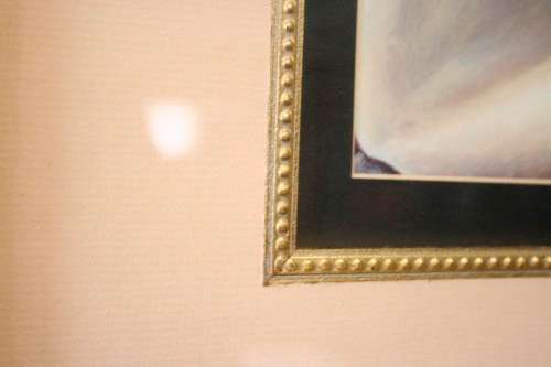 An exquisite signed "JM" print framed behind glass of four Arum Lilies. Stunning in all areas.