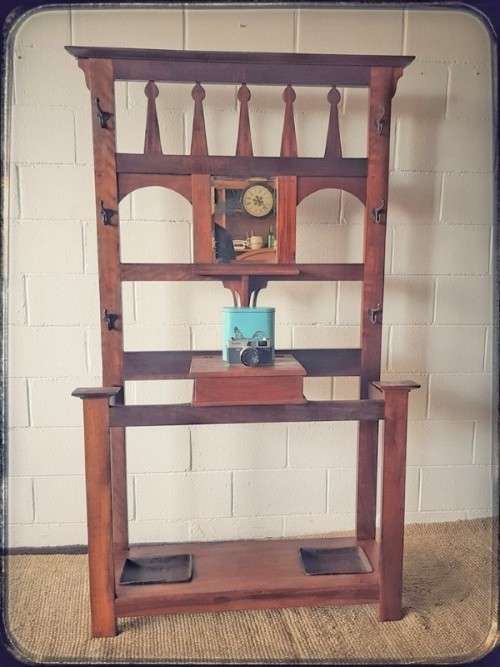 An incredible solid teak and solid blackwood combination hall stand with a bevelled mirror & drawer