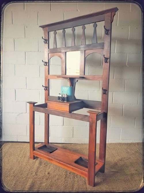 An incredible solid teak and solid blackwood combination hall stand with a bevelled mirror & drawer