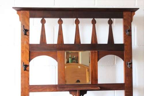An incredible solid teak and solid blackwood combination hall stand with a bevelled mirror & drawer