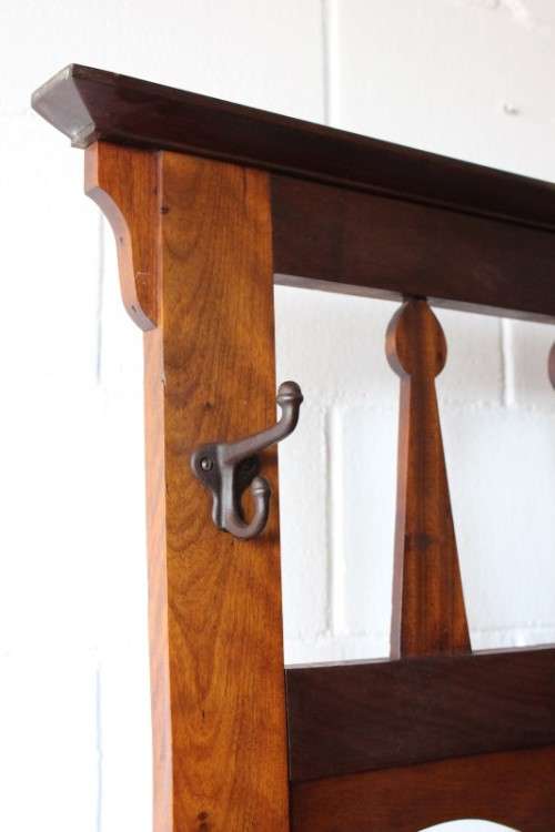 An incredible solid teak and solid blackwood combination hall stand with a bevelled mirror & drawer