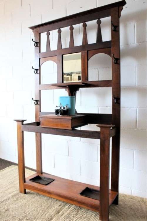 An incredible solid teak and solid blackwood combination hall stand with a bevelled mirror & drawer