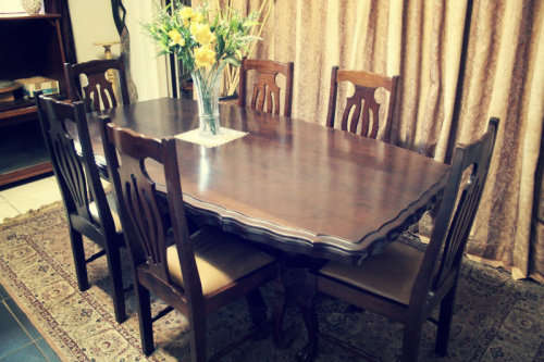 An absolutely stunning vintage Imbuia Ball claw 6 seater dining room table w 6 faux leather chairs