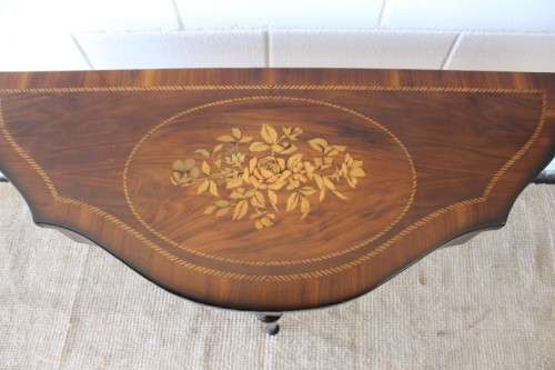 A stunning Italian "half-moon" console table with incredible marquetry and rail inlay detailing