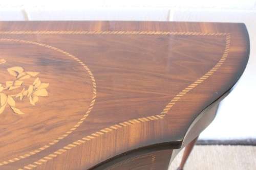 A stunning Italian "half-moon" console table with incredible marquetry and rail inlay detailing