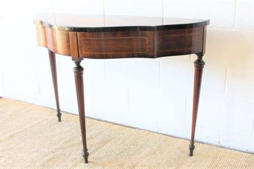 A stunning Italian "half-moon" console table with incredible marquetry and rail inlay detailing