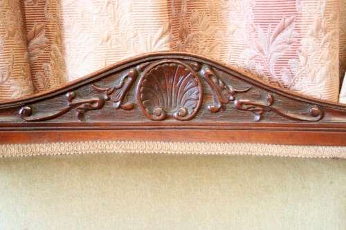 **RS17**  A hand-carved antique Victorian slipper/ nursing chair upholstered in a soft green fabric