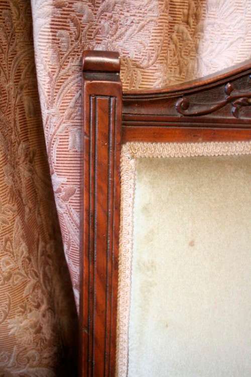 **RS17**  A hand-carved antique Victorian slipper/ nursing chair upholstered in a soft green fabric