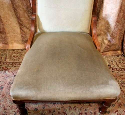 **RS17**  A hand-carved antique Victorian slipper/ nursing chair upholstered in a soft green fabric