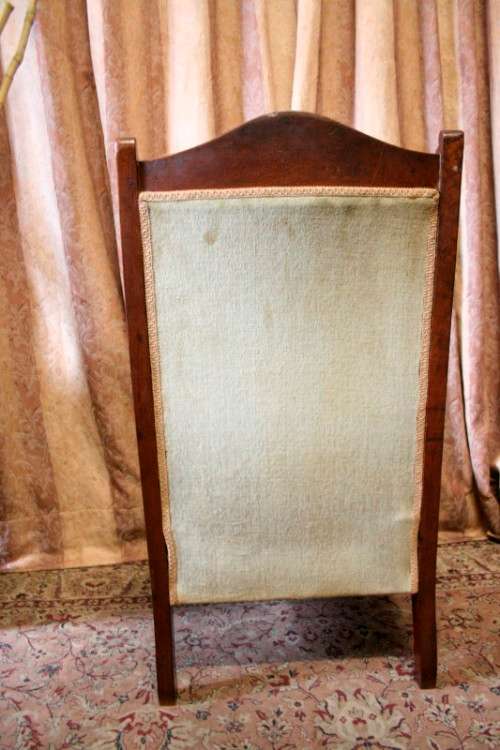**RS17**  A hand-carved antique Victorian slipper/ nursing chair upholstered in a soft green fabric