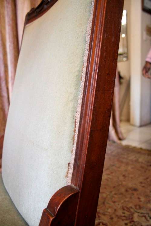 **RS17**  A hand-carved antique Victorian slipper/ nursing chair upholstered in a soft green fabric