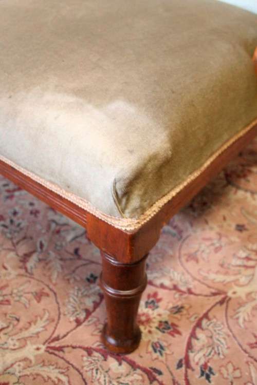 **RS17**  A hand-carved antique Victorian slipper/ nursing chair upholstered in a soft green fabric