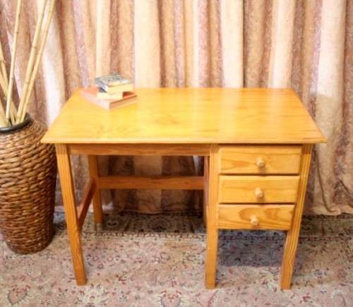 **RS17** A lovely wooden writing/work desk with three spacious drawers in great condition.