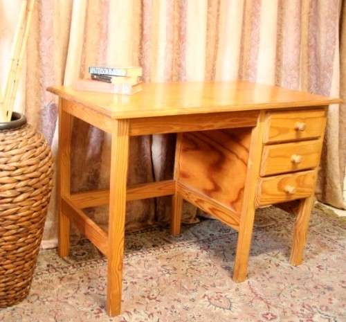 **RS17** A lovely wooden writing/work desk with three spacious drawers in great condition.