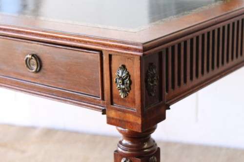 A beautifully detailed vintage Mahogany Regency leather-top library desk with drawers & fluted legs