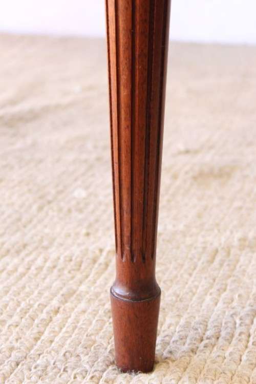 A beautifully detailed vintage Mahogany Regency leather-top library desk with drawers & fluted legs
